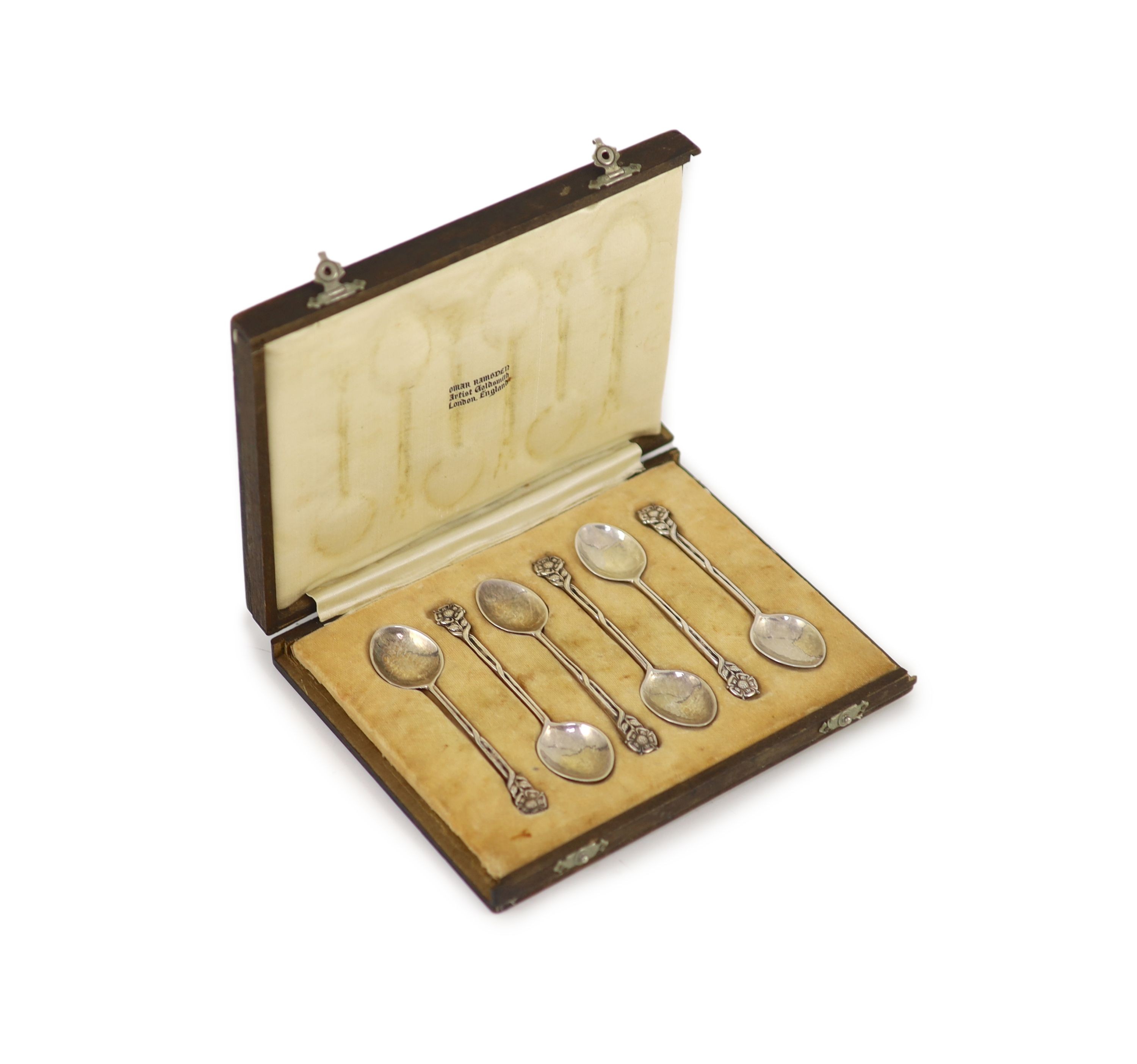 A cased set of six George V Arts & Crafts silver teaspoons, by Omar Ramsden